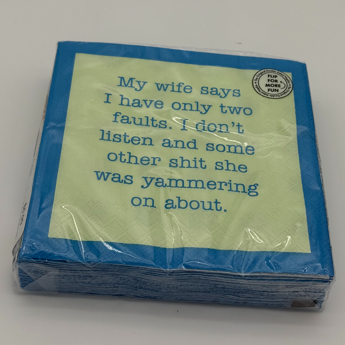 Pack of napkins with humorous text on a yellow background