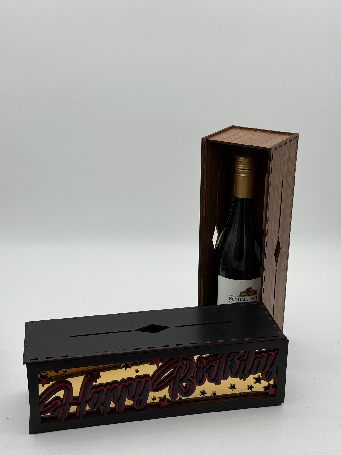 Wooden box with decorative text on a white background