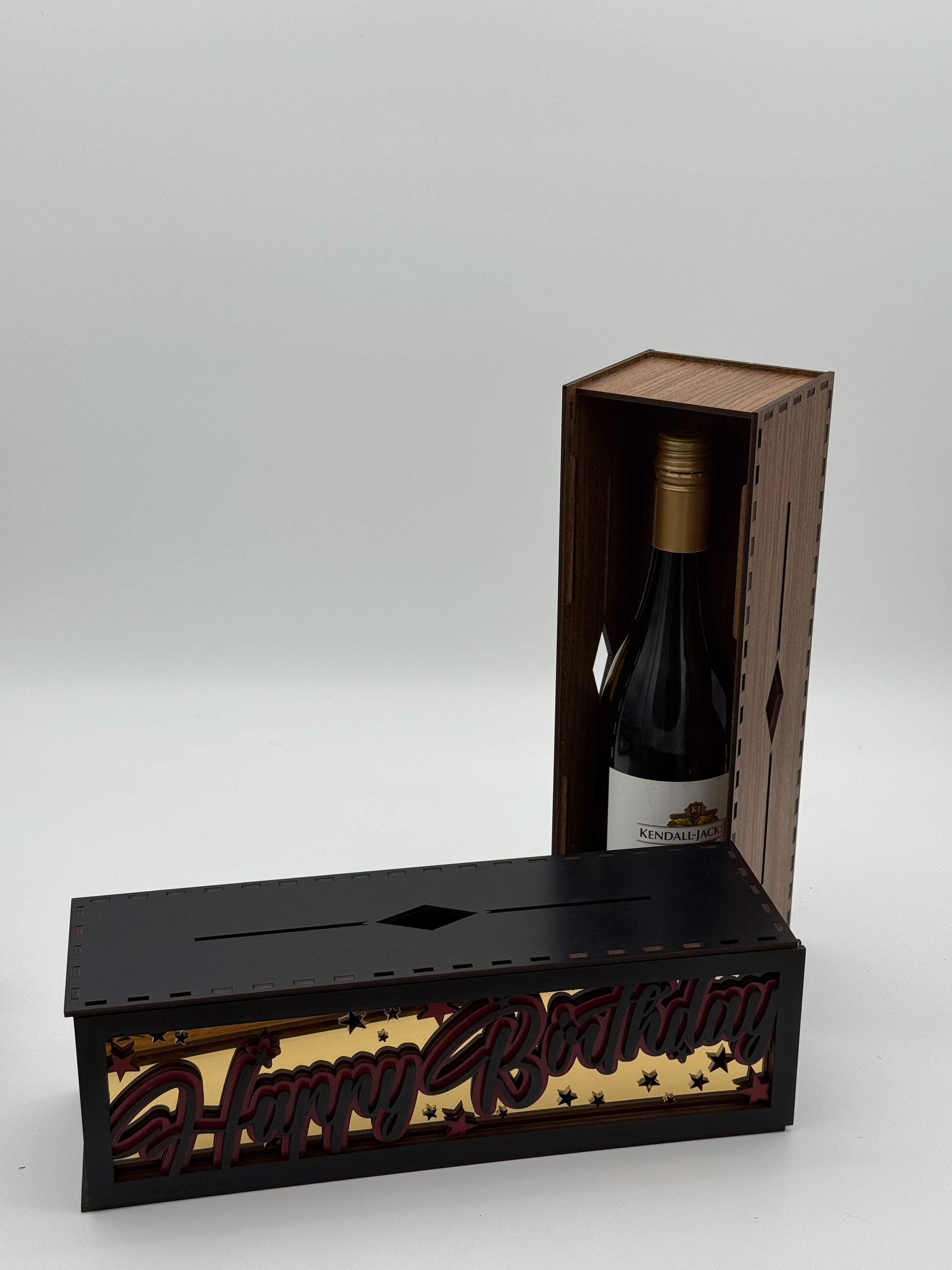 Wooden box with decorative text on a white background